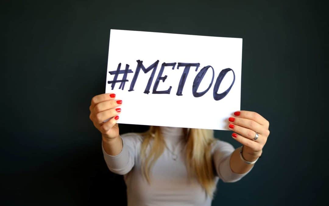 woman holding a sign #metoo related to Sexual Harassment