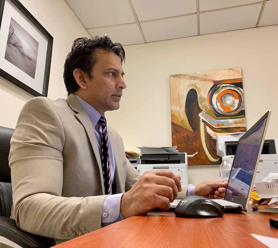 Attorney Jay Chatarpaul working at a desk in New Jersey